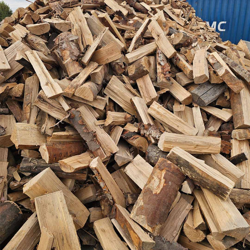 Firewood in loose bulk available in Calgary from TMH Industries, featuring birch and pine firewood for clean burning, efficient heating, and convenient pickup or delivery.