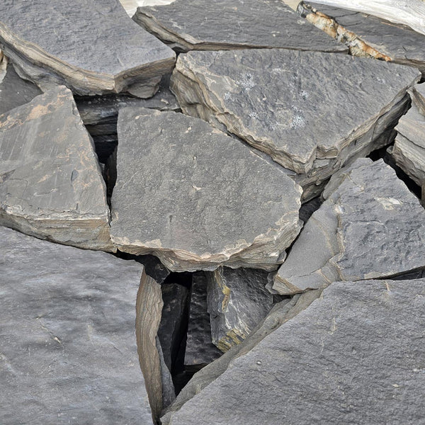 Natural Rundle stone dry stack wall in Calgary yard
