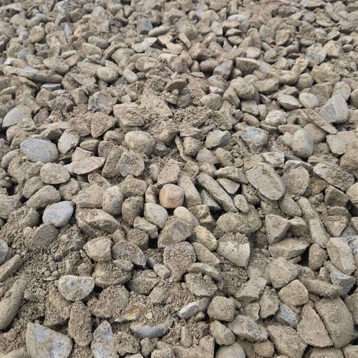 Bulk 40mm crushed fractured rock combined with sand and fines, ideal for drainage and ground stabilization.