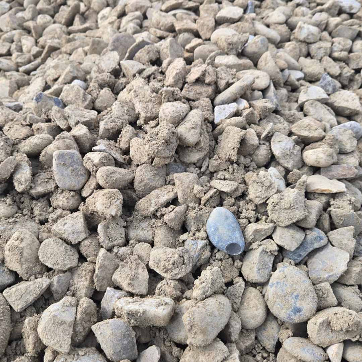Loose 40mm fractured rock mixed with sand and fines, available in bulk for landscaping and construction.