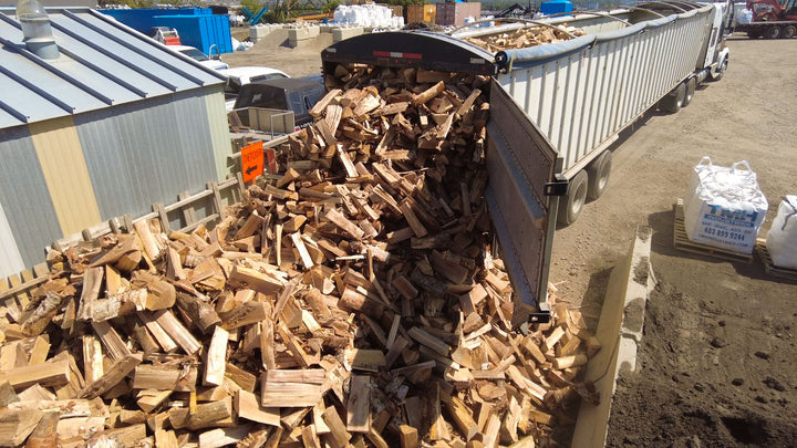 Birch and pine firewood supplier in Calgary from TMH Industries, providing clean dry firewood bags for homes, campsites, and backyard fire pits.