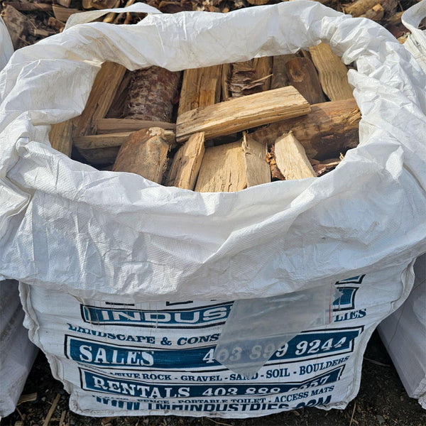 Birch firewood quarter bag, clean premium hardwood ideal for fireplaces, camping, and backyard fire pits from TMH Industries Calgary.
