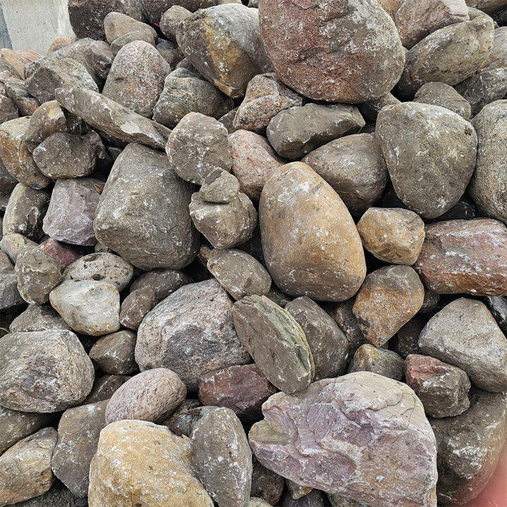 Large decorative river stones with polished appearance for outdoor designs