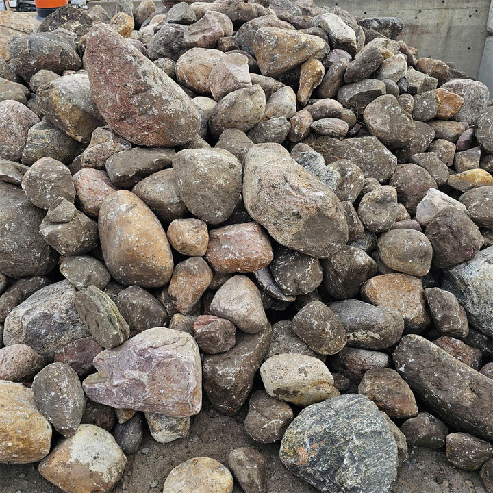 Natural earth-tone river rocks ideal for Calgary garden and yard projects