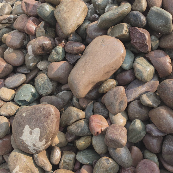 4–10-inch Rainbow River Rock showing its natural colours, rounded shapes, and large stone sizes.