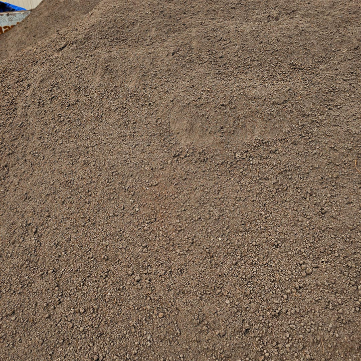 High-quality screened loam soil ideal for planting, leveling yards, and landscaping in Calgary and surrounding areas.